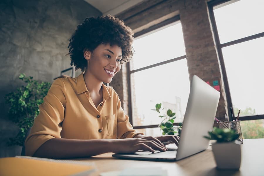 beautiful young woman working on laptop