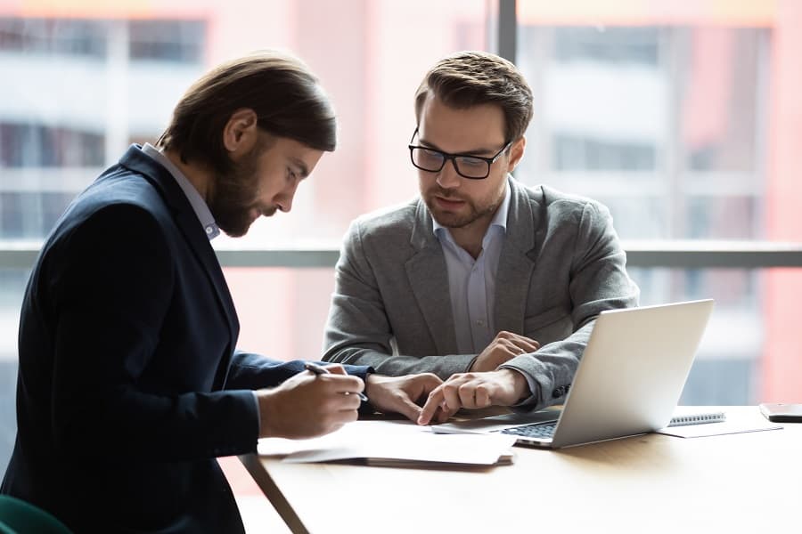 businessmen seriously working at office