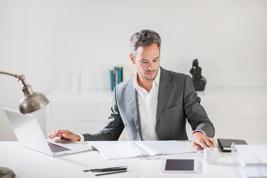 handsome businessman working on his office