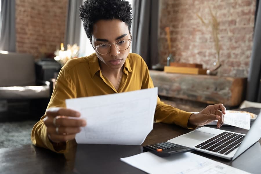 serious businesswoman looking at a paper