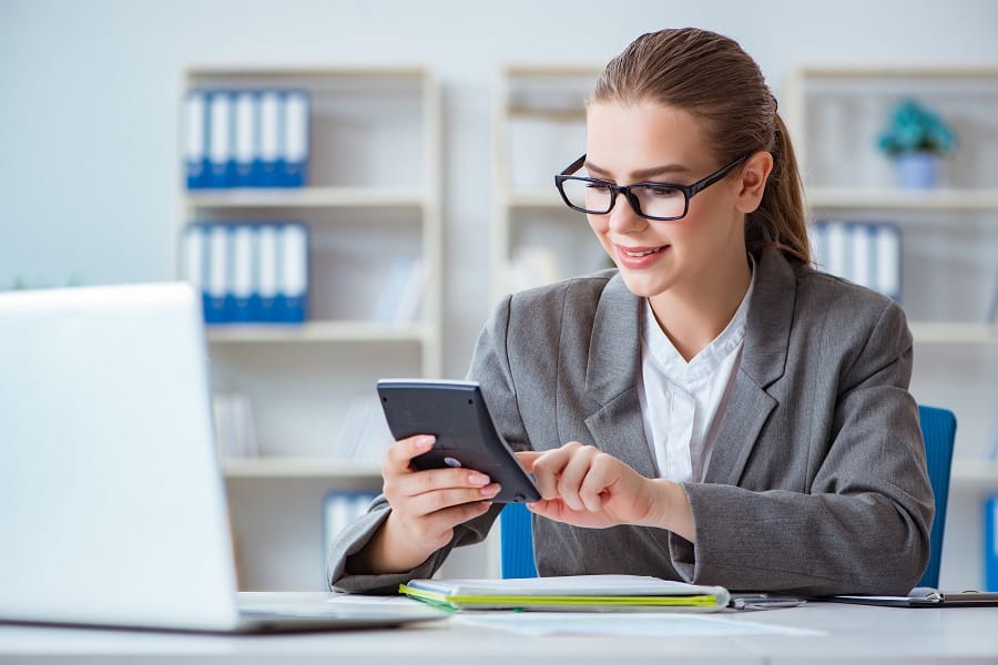 beautiful employee holding calculator