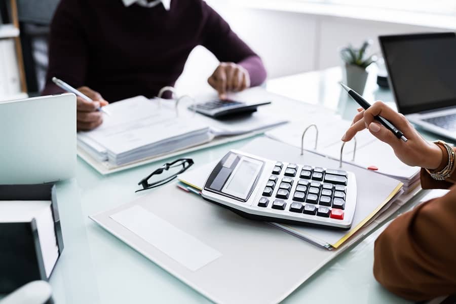 two employees working on balances