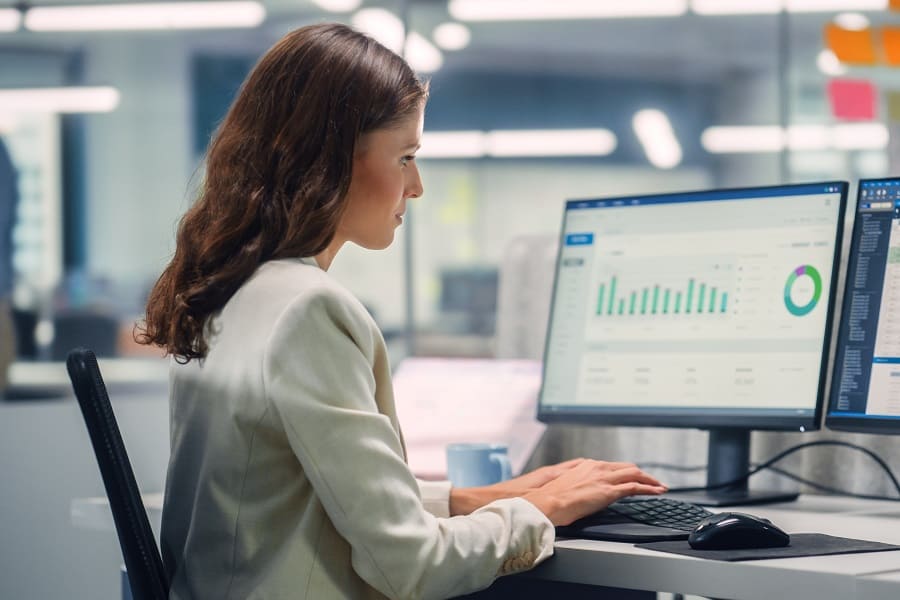 woman in her computer working on payroll