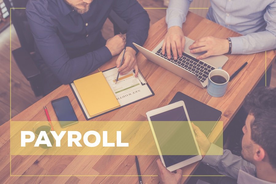 payroll in words with employees working on table